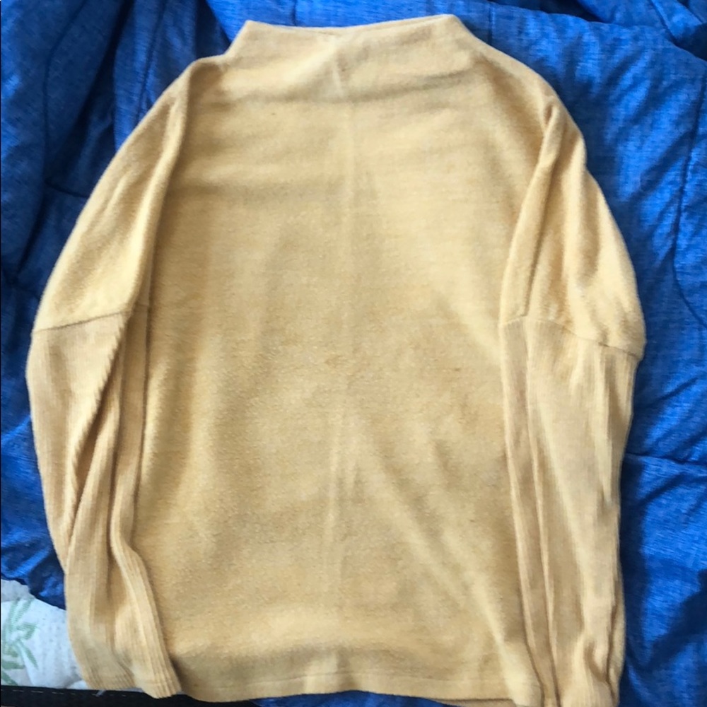 Yellow sweater.